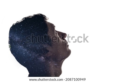 Isolated combination of the silhouette of a man face and the stars of the Milky Way. Concept of the connection between man and the universe, new discoveries and space exploration