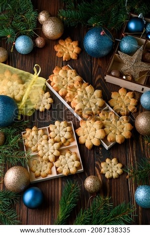Christmas snowflakes gingerbread cookies with Christmas decorations. Christmas celebration concept. Top view