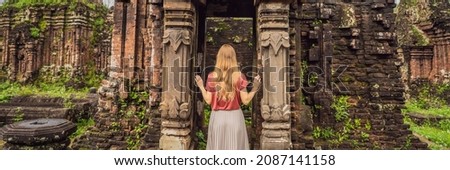 BANNER, LONG FORMAT Woman tourist in Temple ruin of the My Son complex, Vietnam. Vietnam opens to tourists again after quarantine Coronovirus COVID 19 Royalty-Free Stock Photo #2087141158