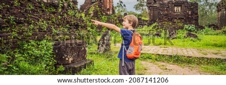 BANNER, LONG FORMAT Boy tourist in Temple ruin of the My Son complex, Vietnam. Vietnam opens to tourists again after quarantine Coronovirus COVID 19