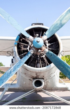 Old airplane engine close up. Radial engine of an propeller aircraft. Propellers on the nose of the aircraft. Royalty-Free Stock Photo #2087172868