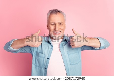 Photo of mature man show fingers thumbs-up perfect ads promotion isolated over pink color background