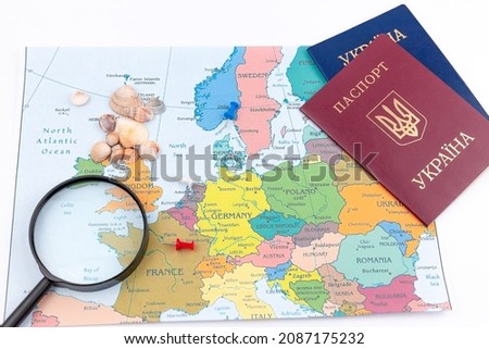 Travel arrangement with dollars, euro, two passports and magnifying glass on a map background. Travel concept. Travel planning for two. Search for interesting sights