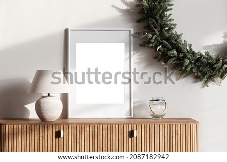 Blank white empty picture frame mockup on white wall. Artwork template in interior design