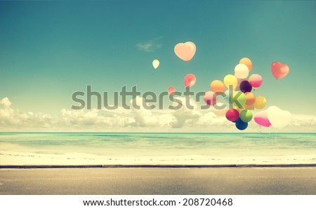 Vintage heart balloon on beach blue sky concept of love in summer and wedding honeymoon Royalty-Free Stock Photo #208720468