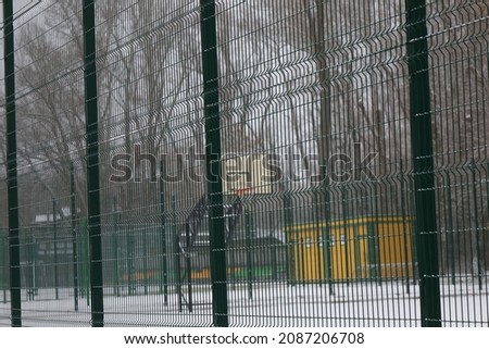 Basketball court in winter in the park