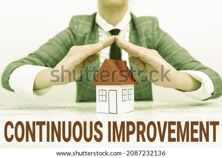 Text caption presenting Continuous Improvement. Conceptual photo Ongoing Effort to Advance Never ending changes New home insurances and coverages plans represeneted by lady