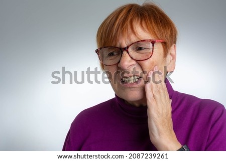 Teeth Problem. Mature Woman Feeling Tooth Pain. Dental Health And Care Concept. Toothache. Senior woman suffering from tooth pain and touching cheek. Dental problem concept. Royalty-Free Stock Photo #2087239261