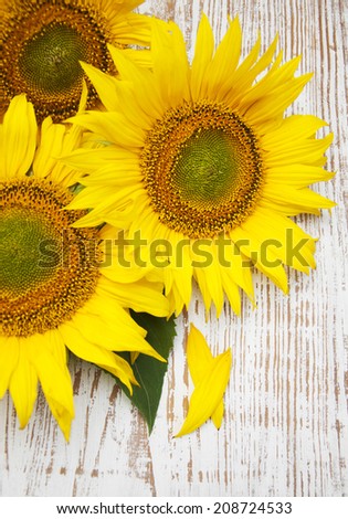 Bright sunflower flowers  on a  wooden  background