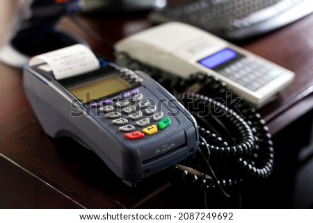 Point of sale, POS terminal device on the table in a store office, business, shop, retail area desk, object closeup, shallow dof, nobody. Contactless transactions, card payment commerce simple concept