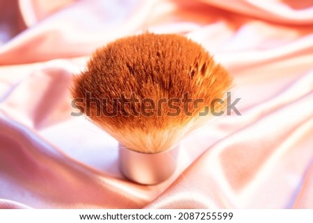 Makeup brush on pink background. beauty concept.