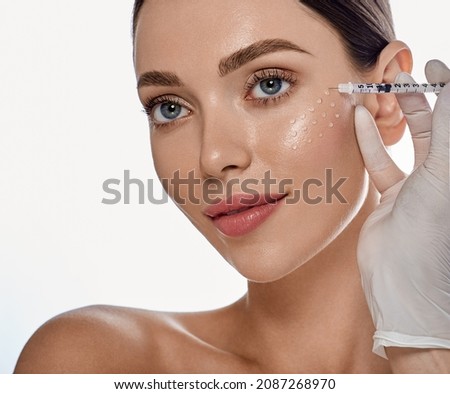 Biorevitalization, anti-aging procedure. Beautiful woman getting beauty injections with hyaluronic acid for smoothing of face mimic wrinkles Royalty-Free Stock Photo #2087268970