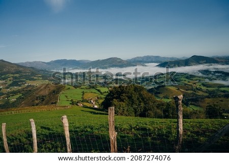 Village and road in mountains valley. Pyrenees. Camino de Santiago landscape. . High quality photo