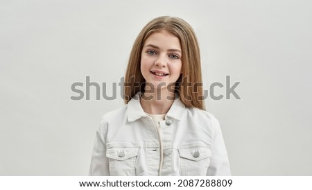 Portrait of smiling pretty teen girl child isolated on white studio background feel positive optimistic. Headshot of happy teenager kid, growing generation of family women. Offspring, descendant.