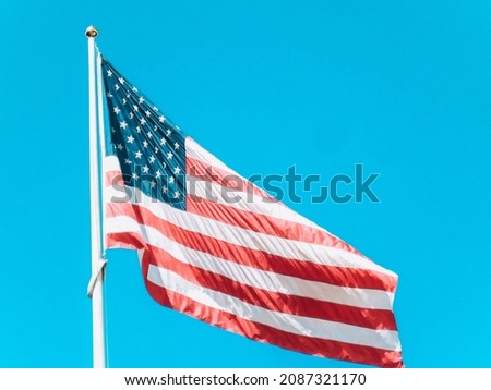 Material flag of the United States of America, sky in background