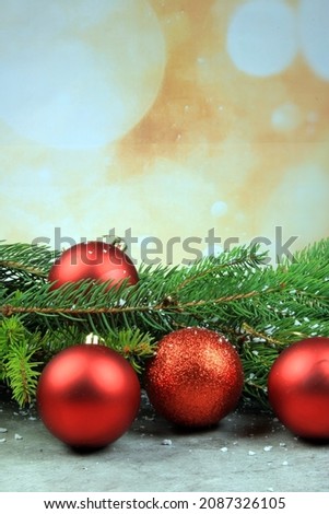 Christmas background with spruce branches, red balls and ornaments