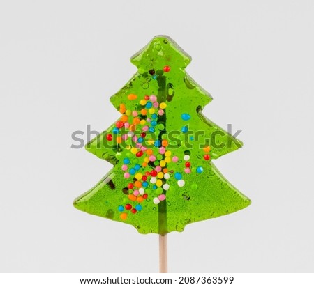 Christmas candy canes in the form of a tree on a white background.