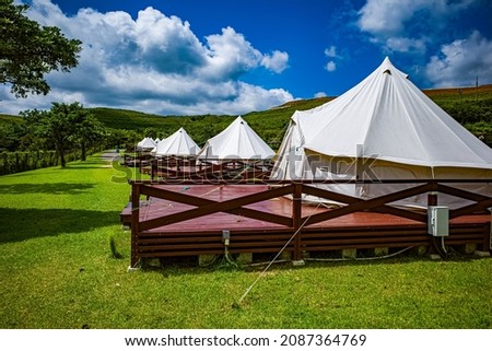 Photo of white tent at campsite