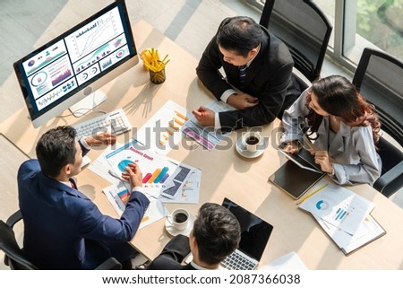 Business data dashboard analysis by ingenious computer software . Investment application display business sales and profit on the computer screen and advise marketing planning decision . Royalty-Free Stock Photo #2087366038
