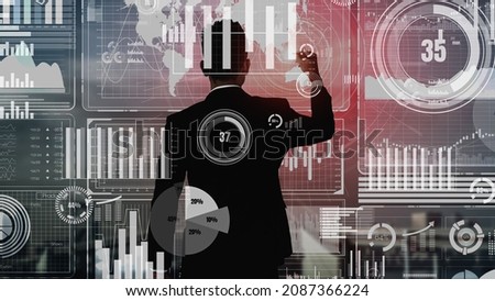 Big Data Technology for Business Finance Analytic conceptual. Modern graphic interface shows massive information of business sale report, profit chart and stock market analysis on screen monitor.