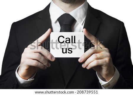 businessman holding card call us