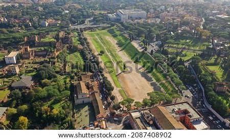 Aerial drone photo of iconic Circus Maximus a green space and remains of a stone - marble arena used for chariot races built next to Palatine hill and world famous Colosseum, historic Rome, Italy Royalty-Free Stock Photo #2087408902
