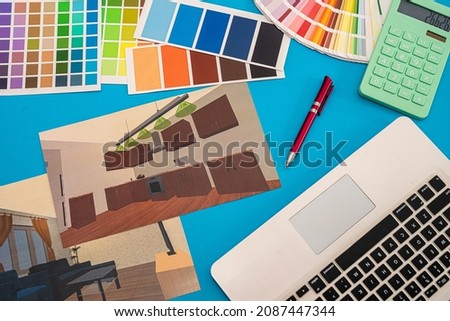 plan of house with colored patterns for repair with laptop on office desk. renovation