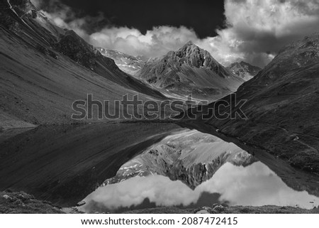 The photo shows the picturesque Aelpli lake in Arosa, Switzerland. Black and white conversion.