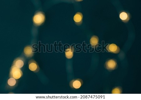 New year lights background, blurred lights, background for poster, blue and yellow colors