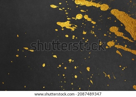 Japanese background with gold splashes on black Japanese paper.