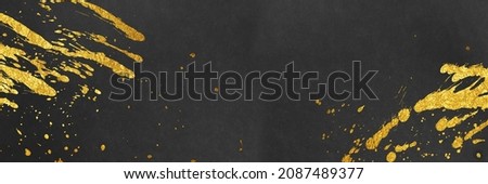 Japanese background with gold splashes on black Japanese paper.