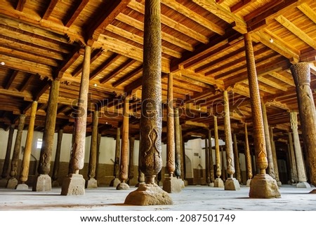 Hall of wooden columns decorated with carvings in Juma Mosque, Khiva, Uzbekistan. Peculiarity is that all columns are absolutely different Royalty-Free Stock Photo #2087501749