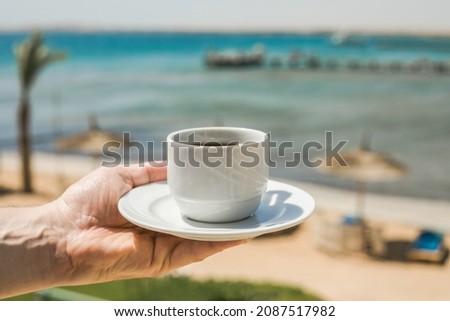 Man hands holding cup of coffee. Good morning sunrise concept. Lets start a new day. Space for text