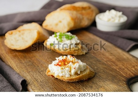 Tasty sandwiches with cottage cheese  on table