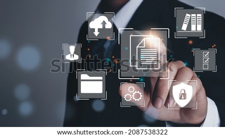 business manager pointing to document for management concept, online documentation database and digital file storage system or software, records keeping, database technology, file access, doc sharing.
