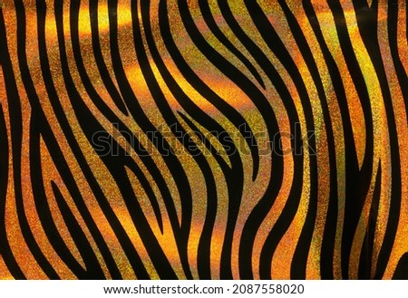 Background with a pattern of tiger stripes, tiger color. Tiger stripes.Tiger skin background or texture.