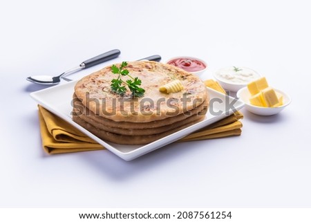 Aloo paratha or gobi paratha also known as Potato or Cauliflower stuffed flatbread dish originating from the Indian subcontinent Royalty-Free Stock Photo #2087561254