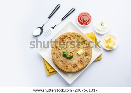 Aloo paratha or gobi paratha also known as Potato or Cauliflower stuffed flatbread dish originating from the Indian subcontinent Royalty-Free Stock Photo #2087561317