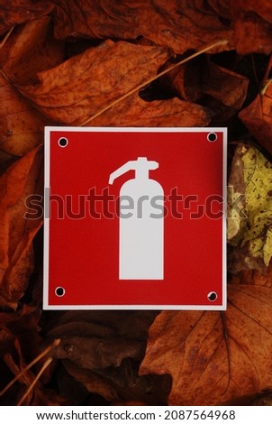 fire extinguisher panel in autumn