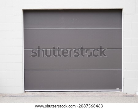 View of modern roller garage door. Copy space stock photo.