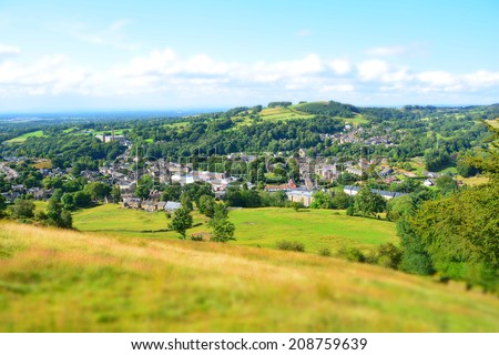 Bollington in Cheshire, England. Former cotton mill town with a former mill in the centre of the image. Miniature effect used to draw attention to the centre of the image. Royalty-Free Stock Photo #208759639