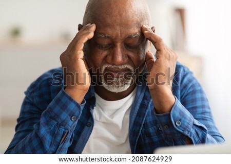 Headache. Senior African American Man Suffering From Migraine Pain Massaging Temples Sitting At Home. Healthcare, Health Problems In Older Age Concept Royalty-Free Stock Photo #2087624929