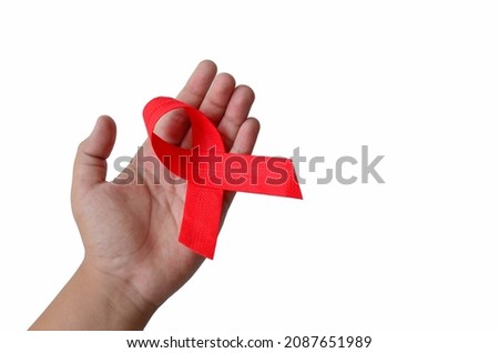 left palm with red ribbon, isolated at white background