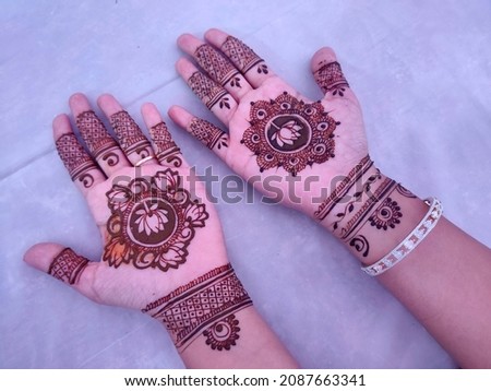Indian bride showing hands mehndi design, mehndi design. Royalty-Free Stock Photo #2087663341