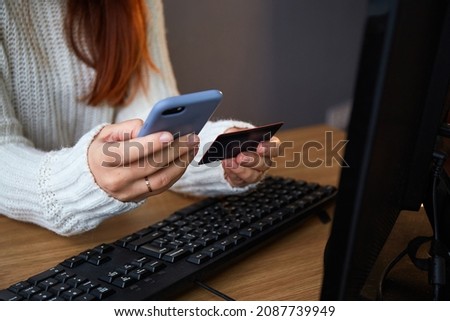 online shoping. Woman using credit card and phone for online shoping Royalty-Free Stock Photo #2087739949
