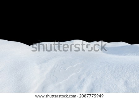 Snow drifts on a black isolated background. Snowy landscape of the hills of the North.