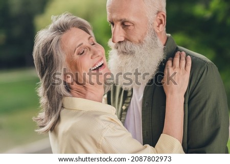 Photo of husband wife retired pensioner old people enjoy weekend summer hug dance feel young outside outdoors in park