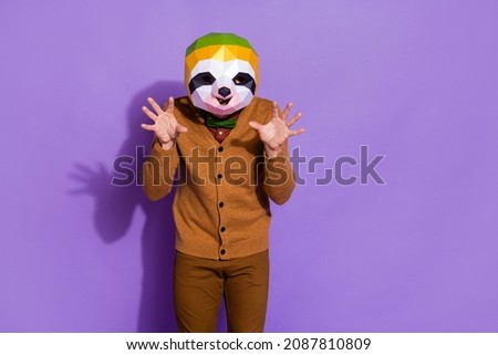Photo of wacky slow sloth mask person arms palms make claws isolated on purple color background