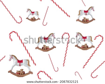 Christmas elements of decor seamless pattern on the white background: candy cane and rocking horse