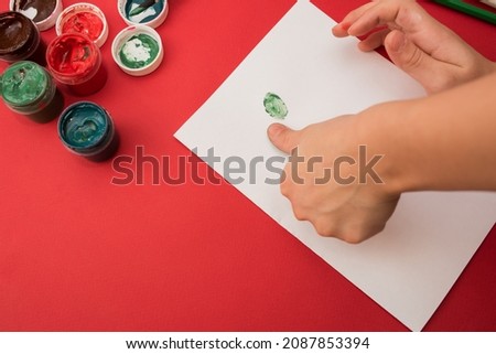 Do it yourself. Making a greeting card for Christmas or New Year. Crafts for the holiday for children. children's creativity at home. Draw a tree with your fingers.Step by step2